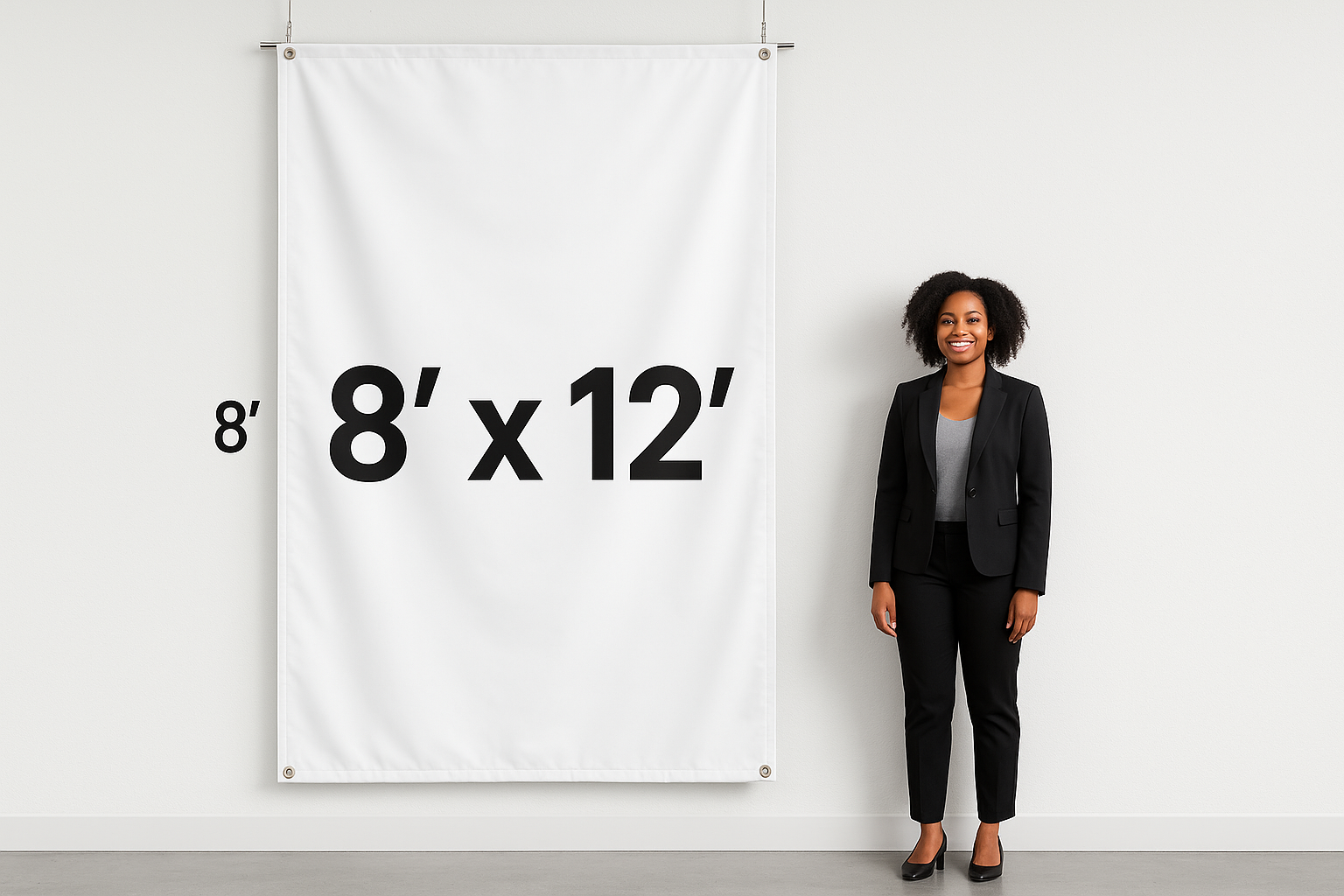 Hanging vinyl banner that shows the measurements 8’ x 12’ on the outside of the banner to show how big the banner is With an adult black female standing next to it that is adverage height